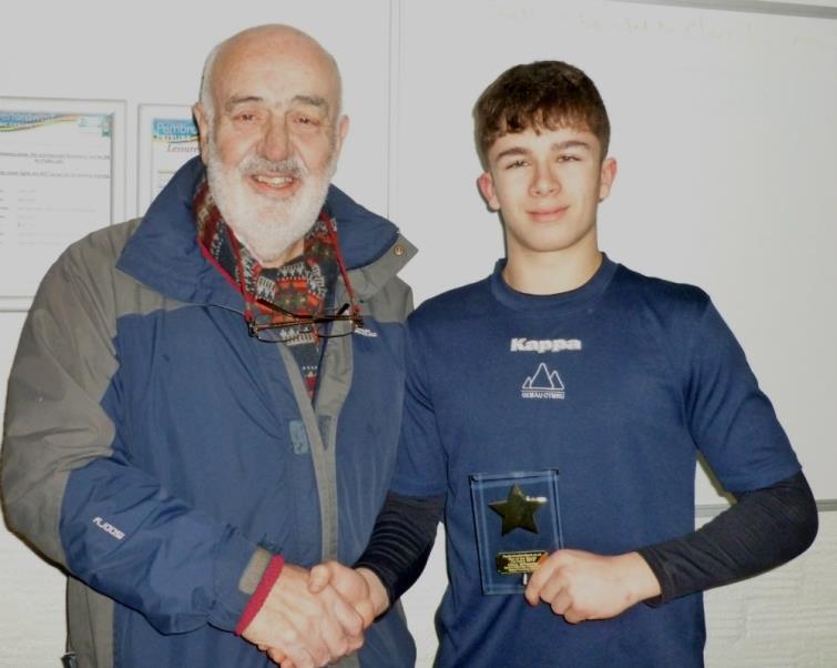 Bill Carne presents star of the month award to Ollie Wheeler